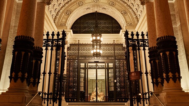 The entrance of the DoubleTree by Hilton hotel with ornate columns and a detailed ceiling. - DoubleTree by Hilton Trieste (Trieste)