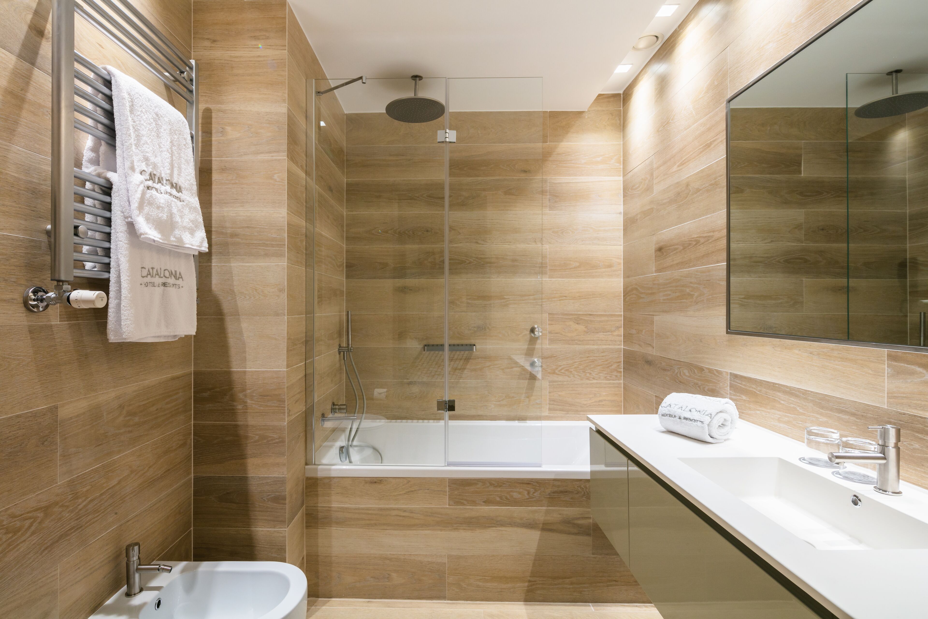 rainfall showerhead, eco-friendly toiletries, hair dryer, towels