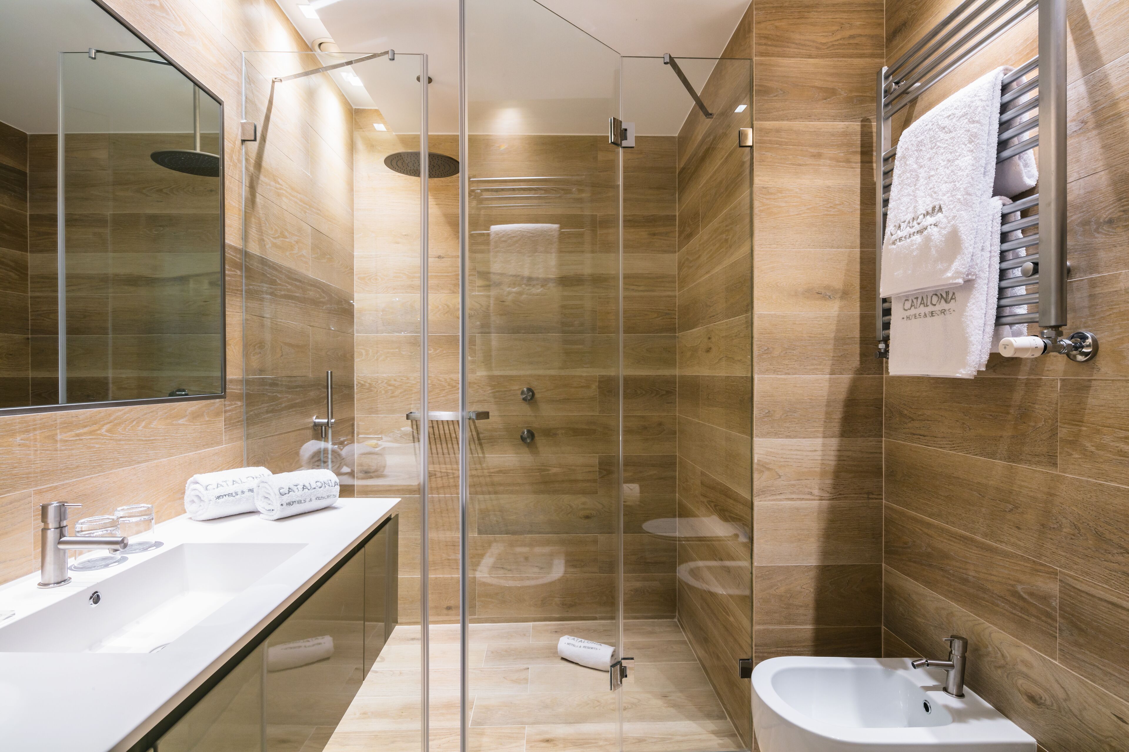 family room | bathroom | rainfall showerhead, eco-friendly toiletries, hair dryer, towels