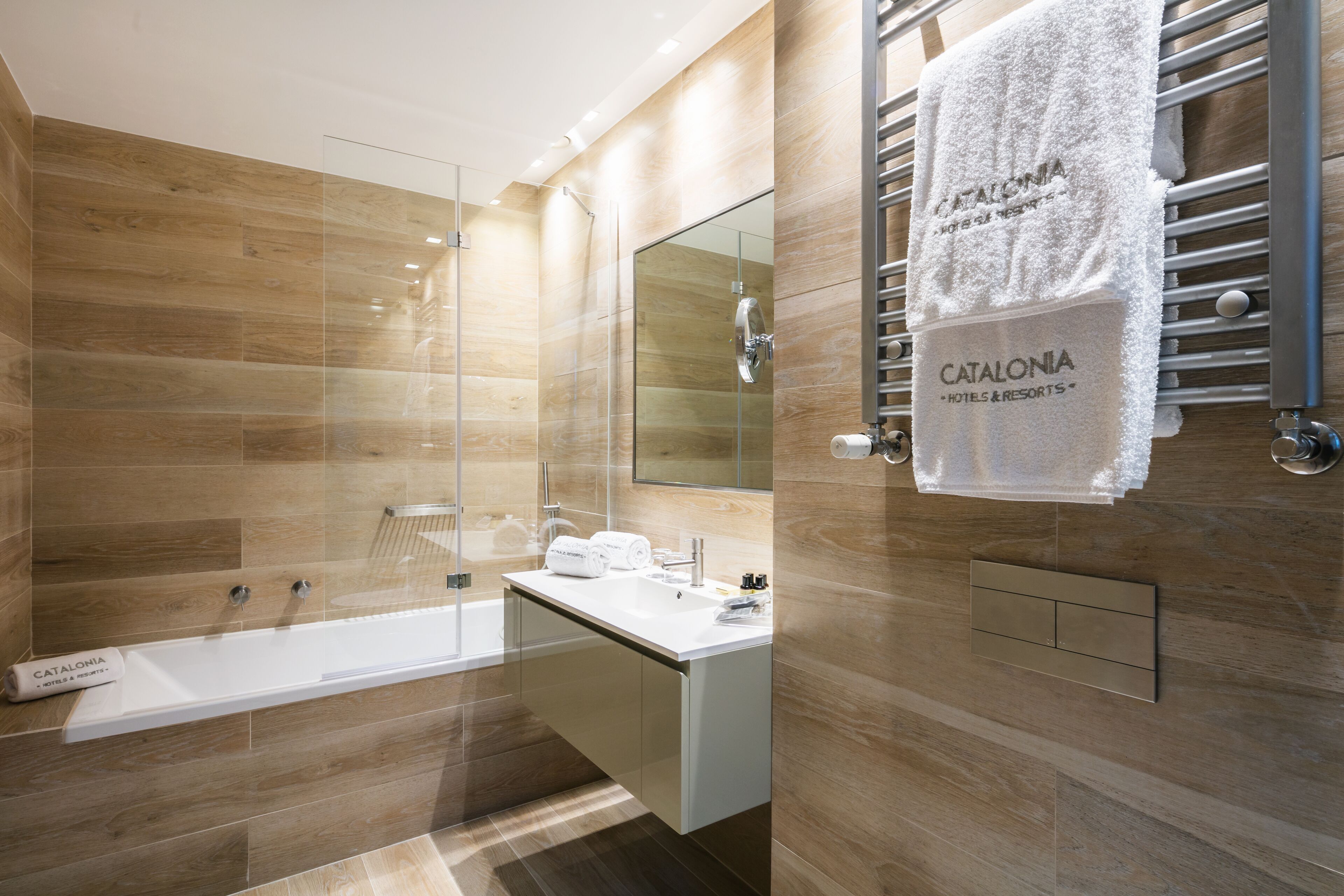 rainfall showerhead, eco-friendly toiletries, hair dryer, towels