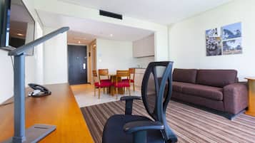 Suite, 2 Bedrooms, Jetted Tub | Living area | 42-inch flat-screen TV with cable channels, TV, MP3 dock