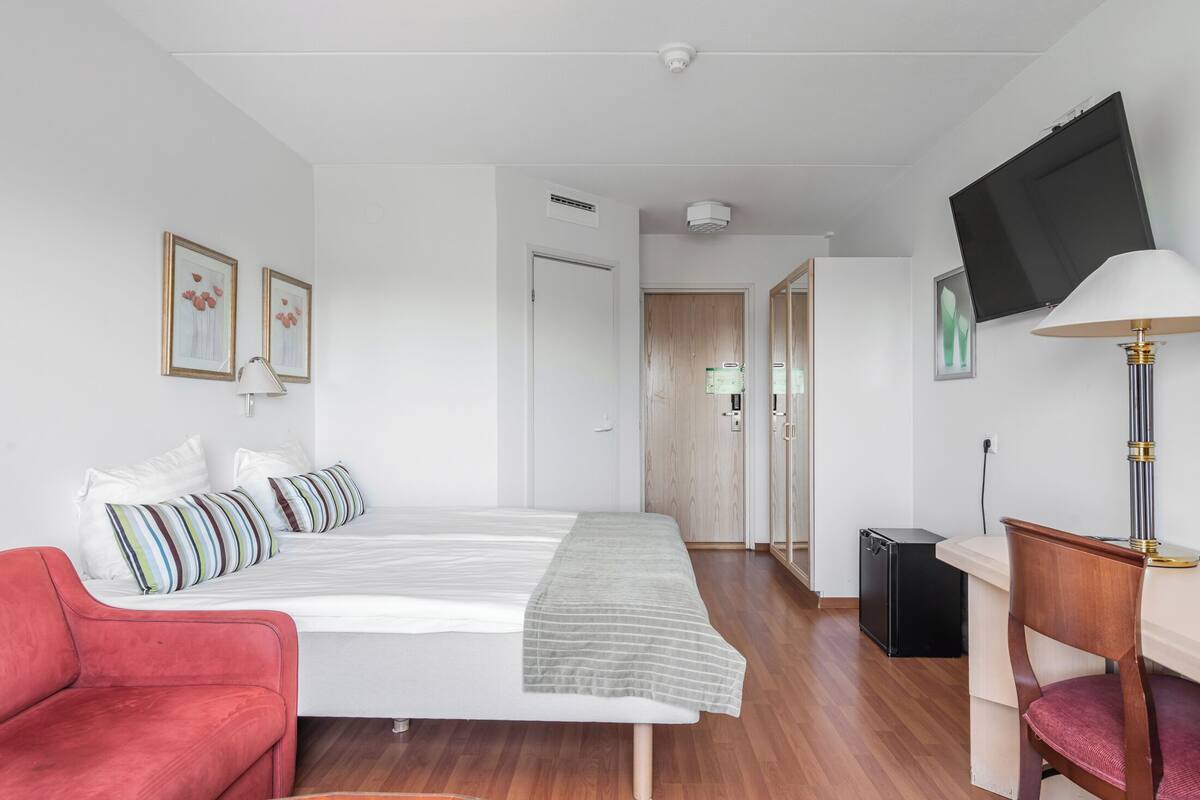 standard single room | desk, laptop workspace, blackout curtains, iron/ironing board