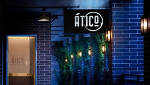 A modern building entrance with a sign reading "ÁTICO" and a glass door leading inside. - SpringHill Suites by Marriott Fort Worth Historic Stockyards (Fort Worth)