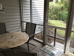 Relax in this inviting room with a sliding door leading to a serene outdoor space.