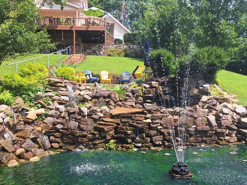 Private country hillside setting surrounded by trees, birds, wildlife pond/falls