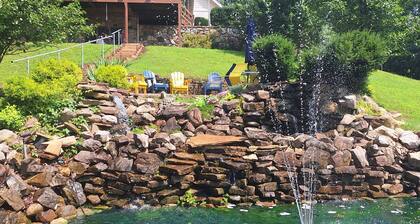 Private country hillside setting surrounded by trees, birds, wildlife pond/falls