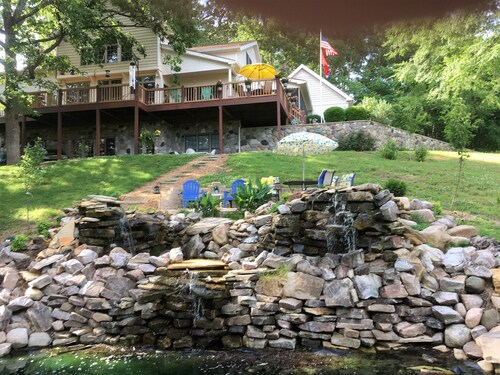 Private country hillside setting surrounded by trees, birds, wildlife pond/falls