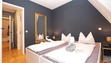 Premium bedding, blackout curtains, iron/ironing board