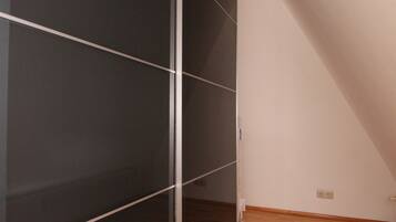 Premium bedding, blackout curtains, iron/ironing board