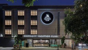 A Marriott Vacation Club building with a prominent illuminated sign, large windows, and a well-lit entrance. - Marriott Vacation Club®, San Francisco (San Francisco)