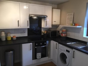 Appartamento, letti multipli | Cucina privata | Frigorifero con congelatore, microonde, forno, piano cottura