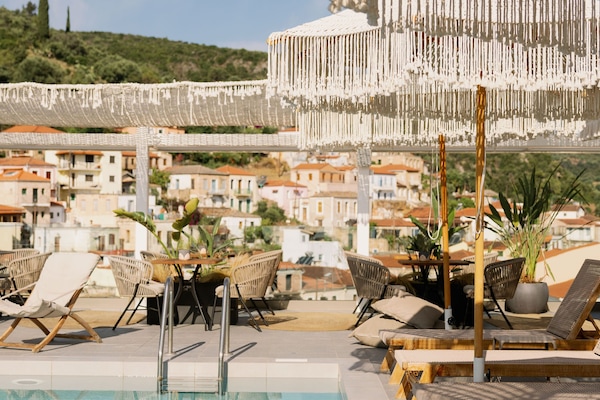 Outdoor pool, open 11:00 AM to 7:00 PM, pool umbrellas, pool loungers