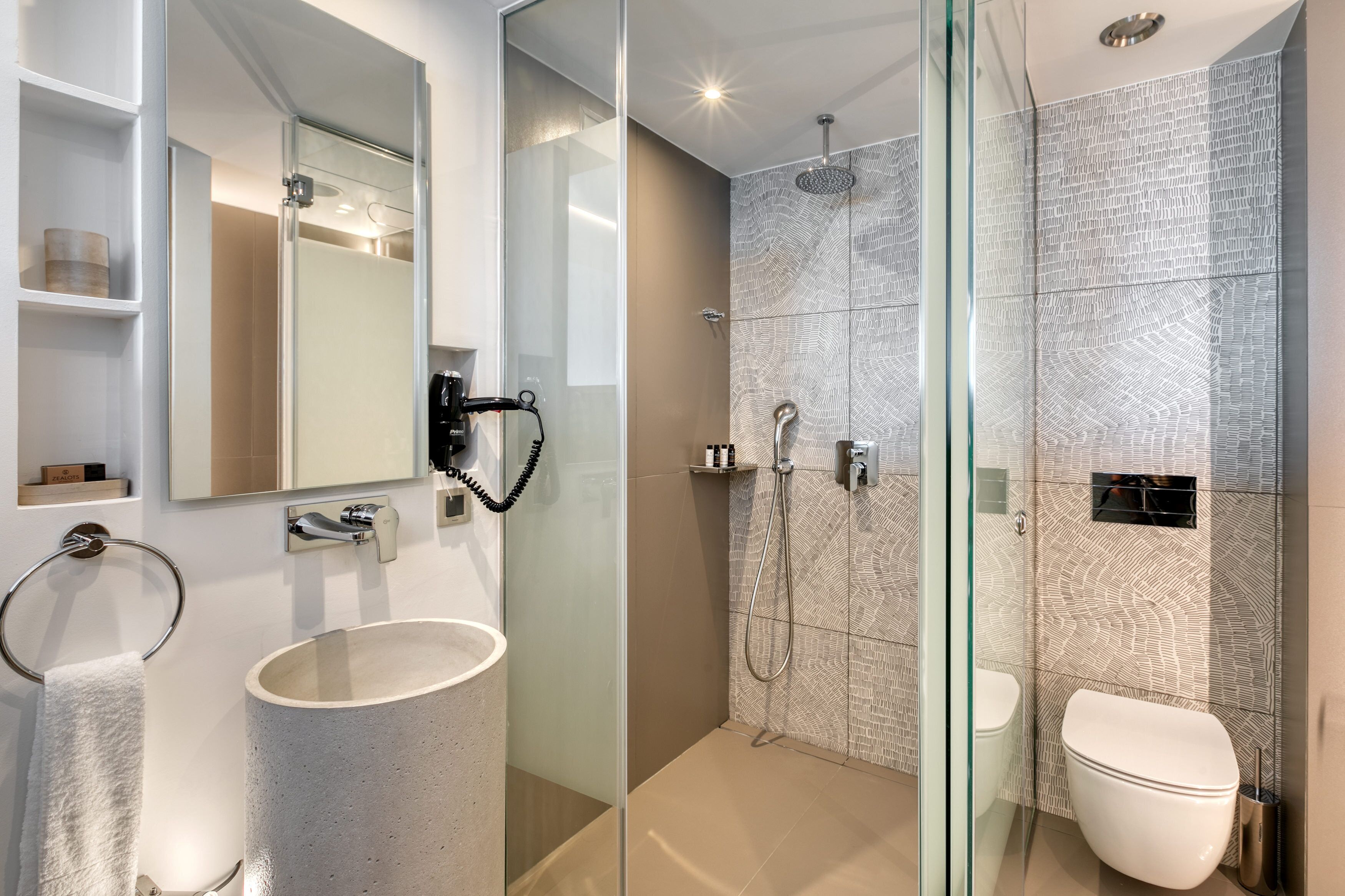 shower, hair dryer, slippers, towels