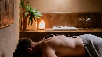 Experience a serene spa setting with a soothing massage, a tranquil ambiance, and a focus on relaxation.