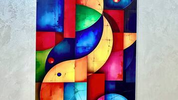 A colorful abstract painting with geometric shapes and lines.