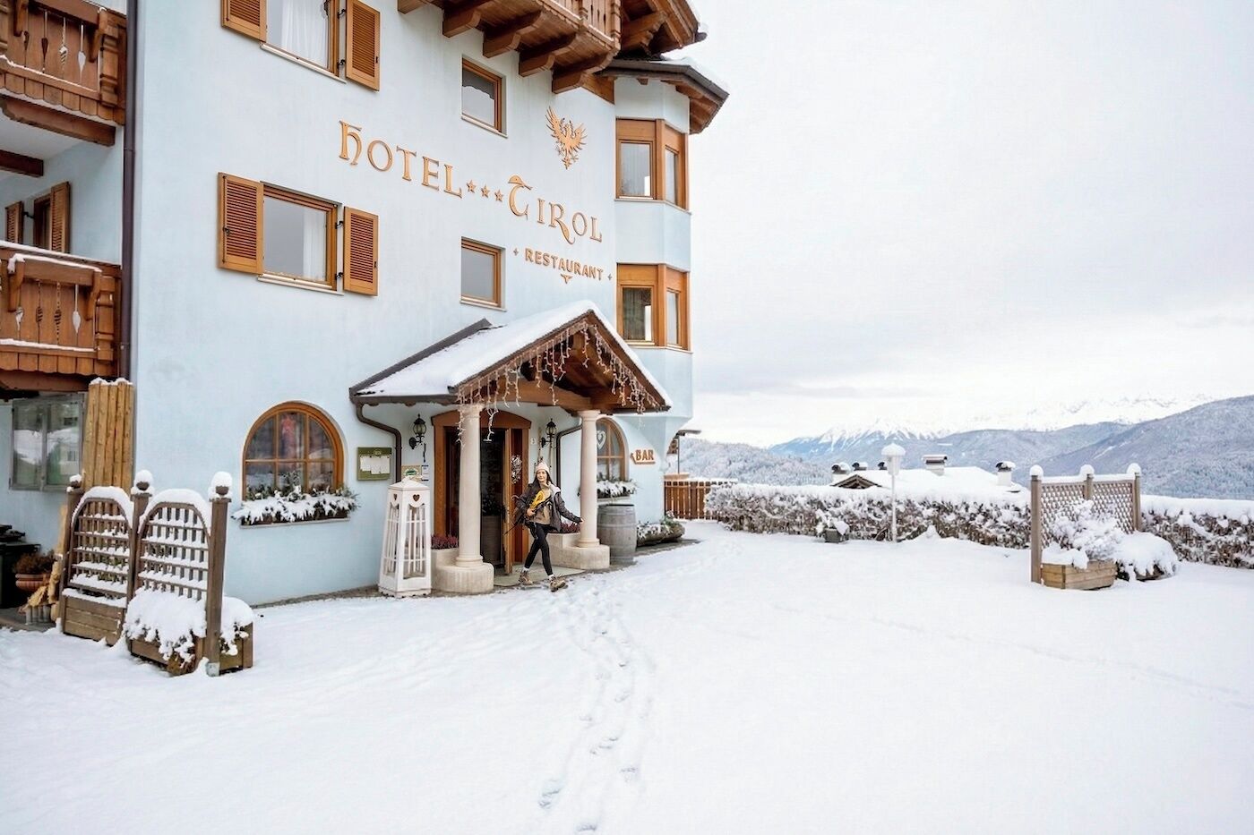 A hotel with a restaurant and bar, surrounded by snow-covered landscape.