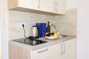 Microwave, coffee/tea maker, toaster, cookware/dishes/utensils