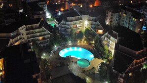 An aerial view of a residential area with a swimming pool surrounded by buildings. - Charis Cozy Family Apart. at Sun Village  - ONLY 10 mins Walk to the Beach (Bourgas)