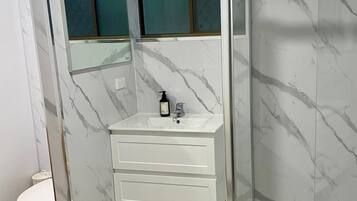 Shower, hair dryer, towels, soap