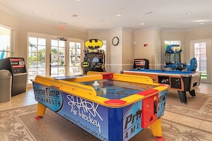 An indoor recreational area with a foosball table, a table tennis table, and a video game machine. - New Listing! Vista Cay Resort, 7mi to Disney & 3mi to Universal - IT2437 (Orlando)