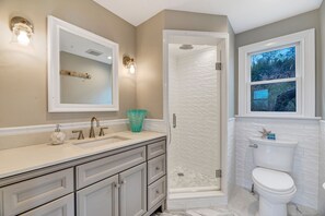 Bathtub, hair dryer, towels, soap