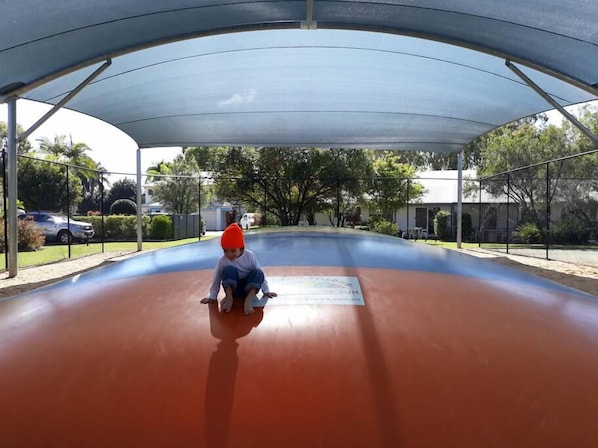 A covered outdoor area with a curved roof structure.