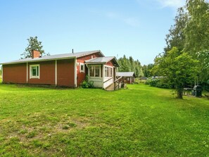 A two-story house with a covered porch and a small adjacent structure. - Matkonranta by Interhome (Kerimäki)