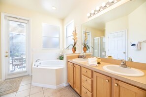 Combined shower/bathtub, hair dryer, towels, soap