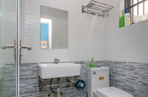 Shower, hair dryer, slippers, soap