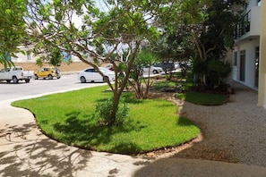 Stroll through the beautifully landscaped grounds to this single-story home with a balcony.