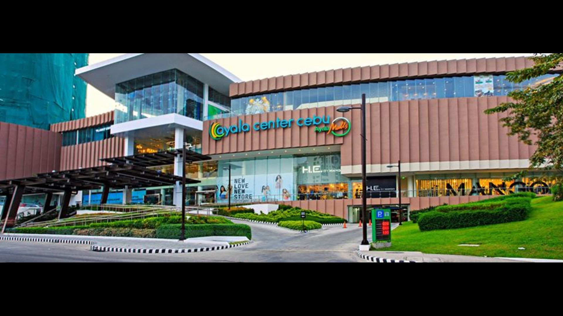 A modern shopping center with a prominent 'Ayala Center Cebu' sign.