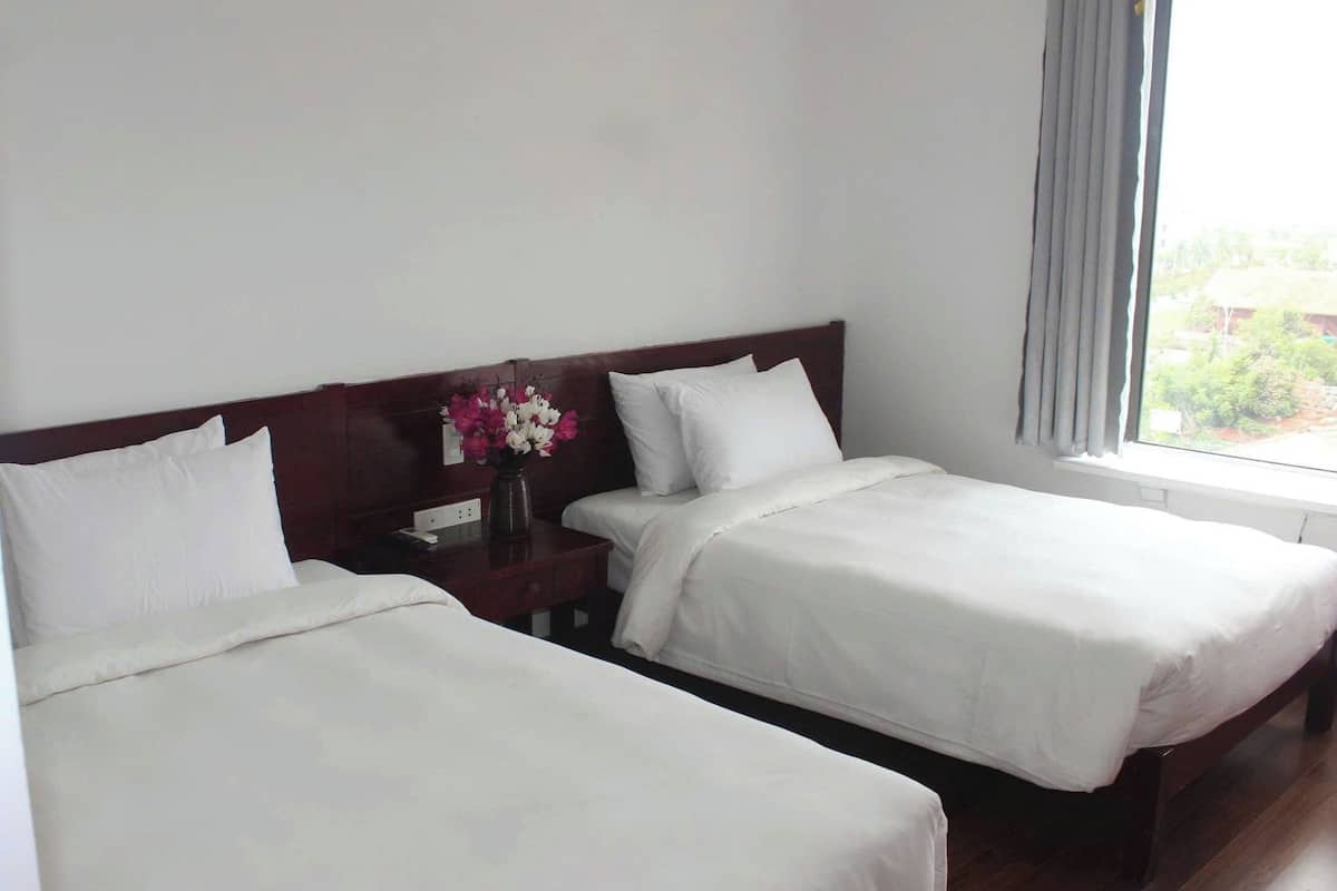 Triple Room | Minibar, desk, laptop workspace, blackout drapes