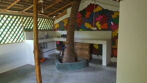 Family Triple Room, Garden View | Private kitchen