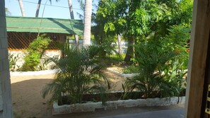 Family Triple Room, Garden View | Garden view