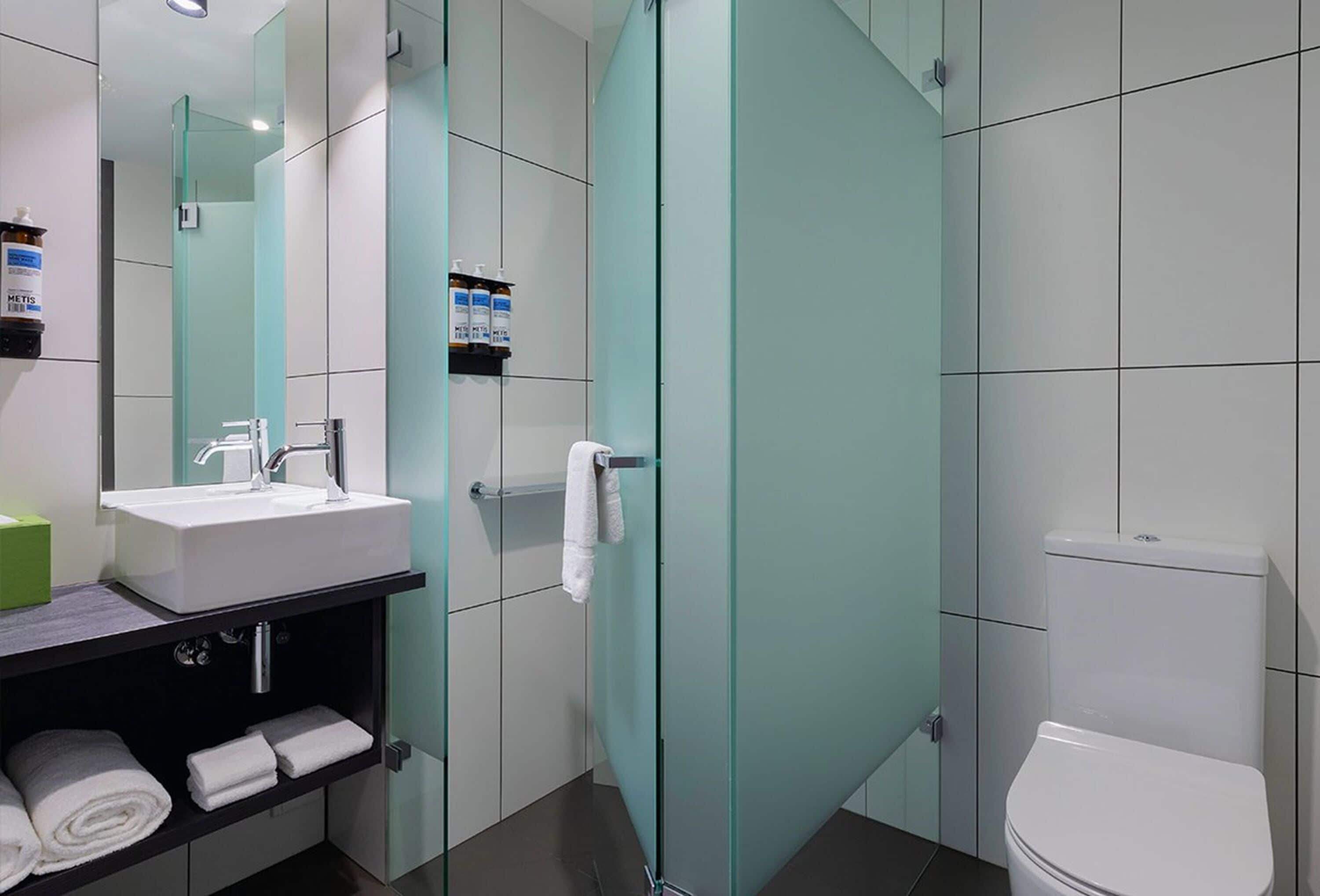 shower, designer toiletries, hair dryer, towels