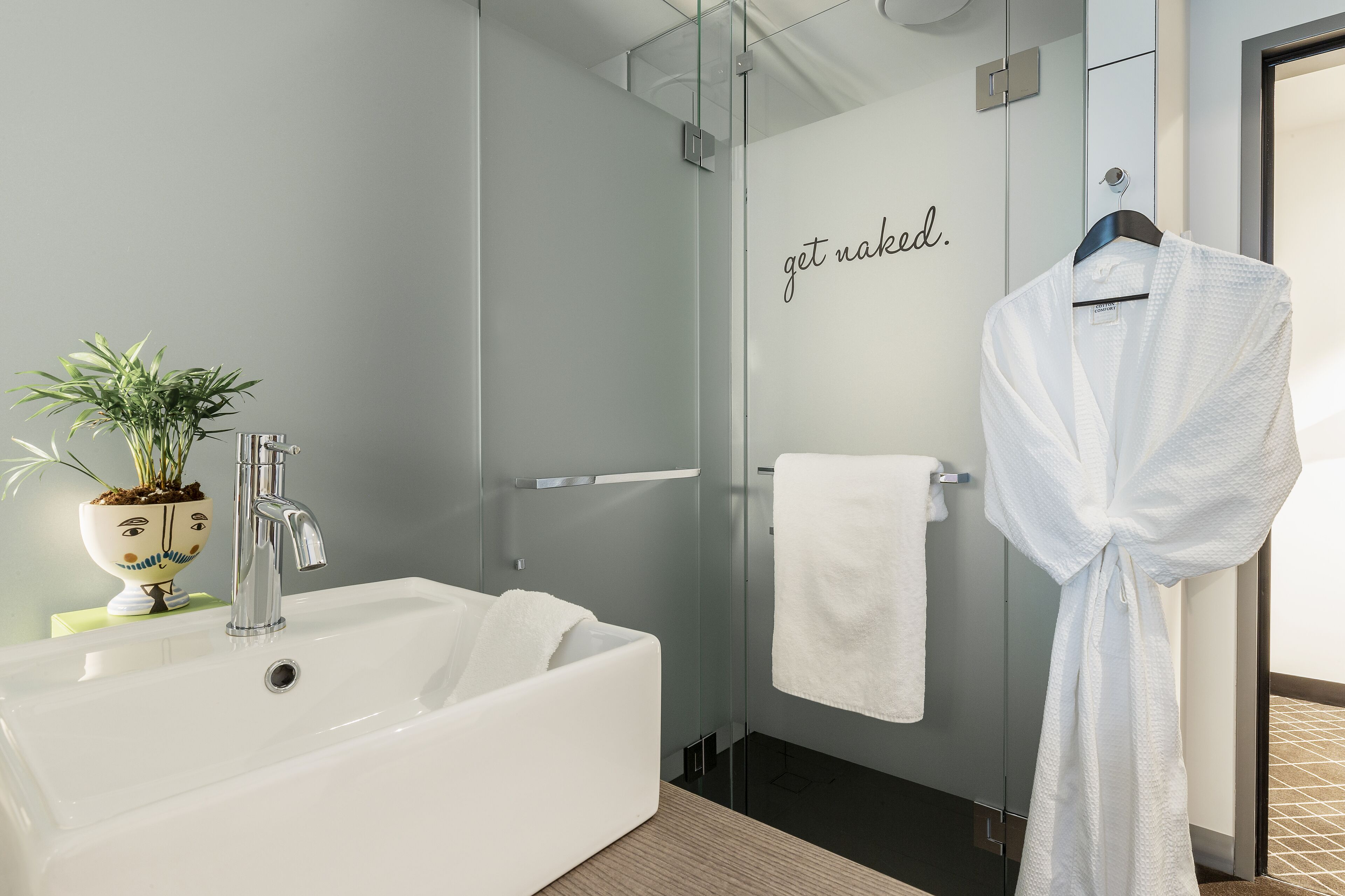 shower, designer toiletries, hair dryer, towels