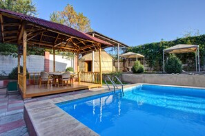 Seasonal outdoor pool, cabanas (surcharge), pool umbrellas