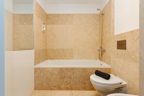 Bathtub, hair dryer, towels