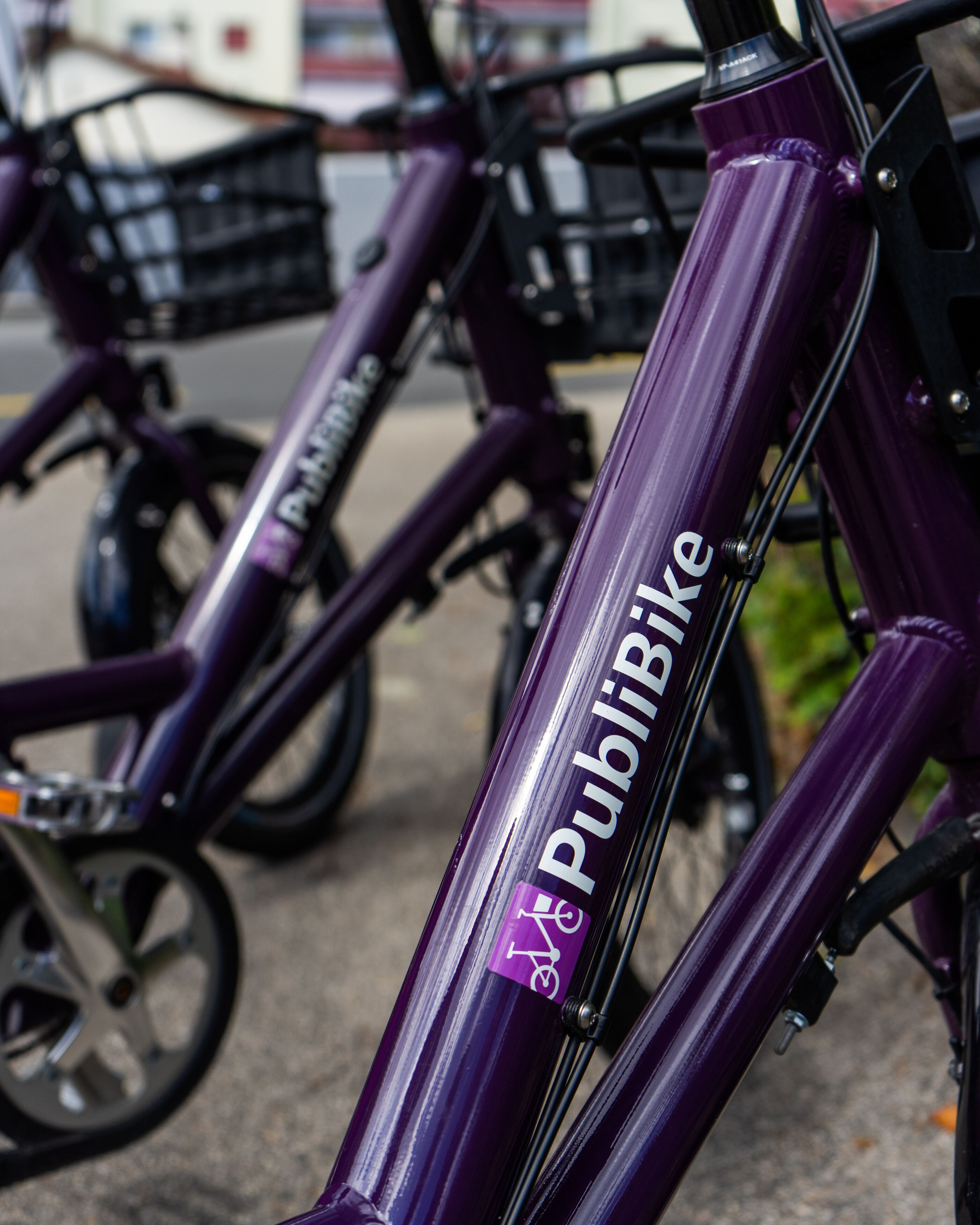 A purple bicycle with the label "PubBike" on the frame.