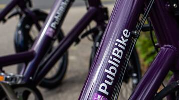 A purple bicycle with the label "PubBike" on the frame.