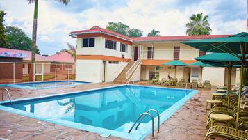 Outdoor pool, pool umbrellas, sun loungers