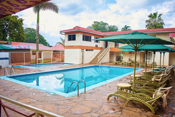 Outdoor pool, pool umbrellas, pool loungers