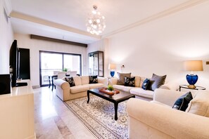 Family Apartment, City View | Living area | 55-inch LED TV with digital channels, TV, Netflix - Fairmont North Luxury 2 BR Apt Palm (Dubai)