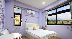 A room with a bed, a desk, and a window with a view of buildings and mountains. - Ark Stay (Jiji)