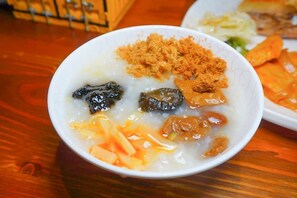 A bowl of porridge with various toppings. - Ark Stay (Jiji)
