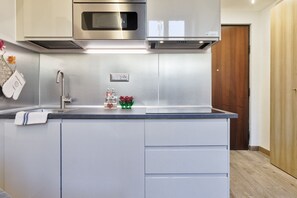 Fridge, microwave, toaster, cookware/dishes/utensils