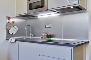 Fridge, microwave, toaster, cookware/dishes/utensils