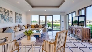 Luxury Villa, Beach View | Living area | Flat-screen TV - Six BDR Villa Palm Tropic Palm Jumeirah (Dubai)