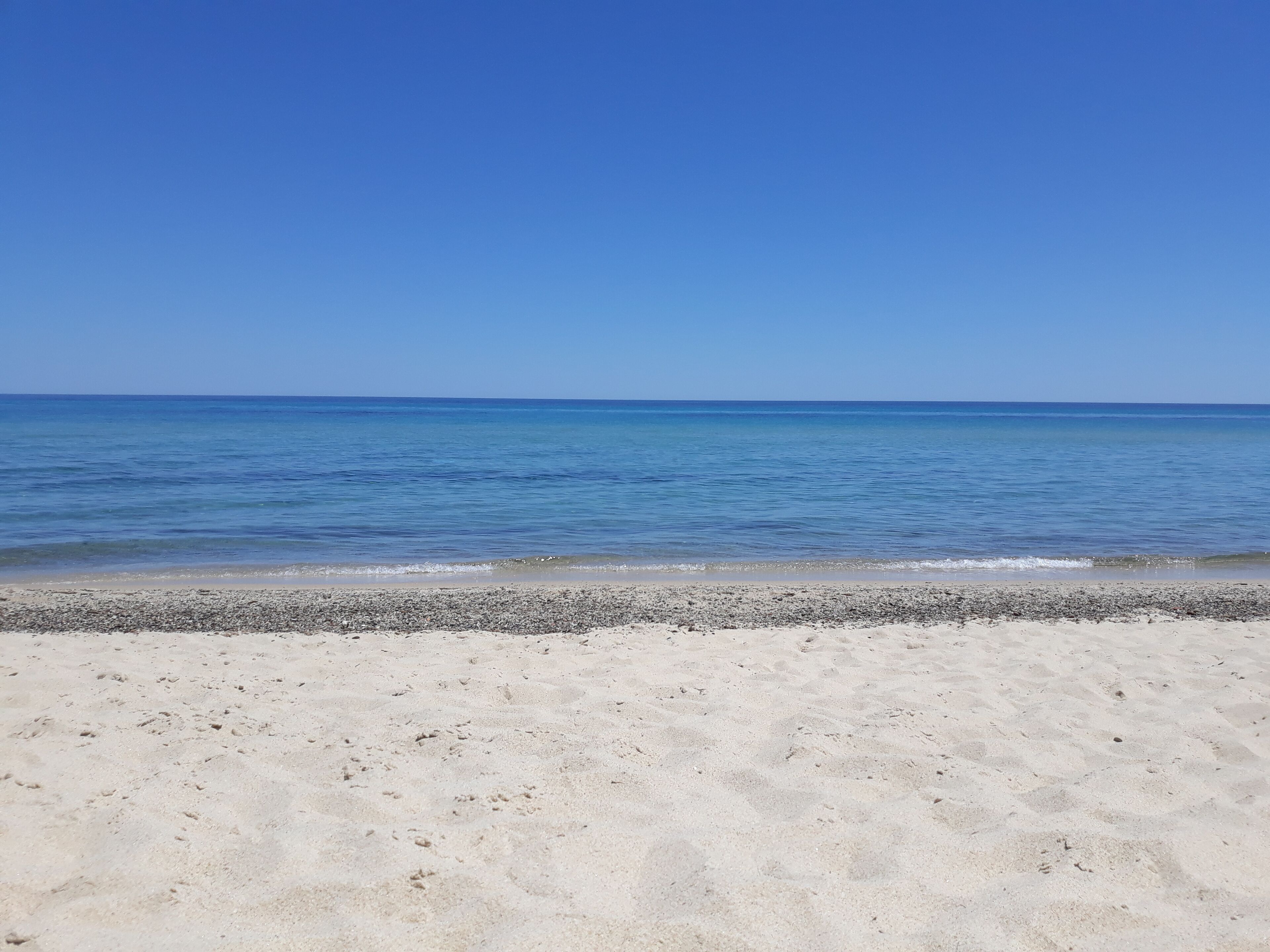 On the beach, sun loungers, beach towels