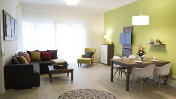 Premium Apartment | Living room | Flat-screen TV, heated floors